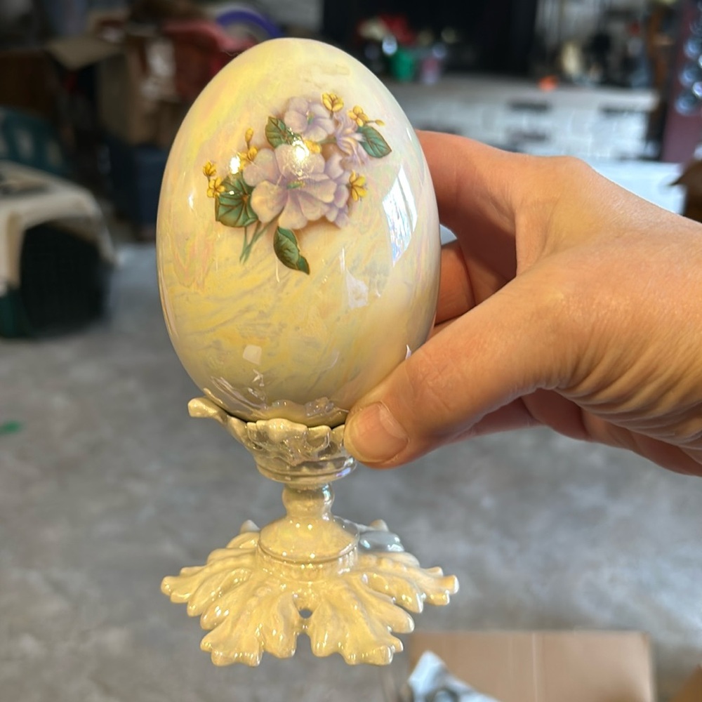 Decorative porcelain egg with stand. Iridescent and beautiful.
